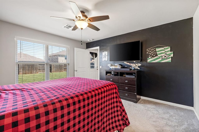 1105 NW 3rd St, Newcastle, OK 73065 - bedroom featuring light colored carpet, visible vents, baseboards, and a ceiling fan