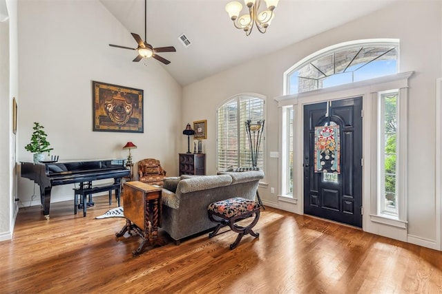 4608 Greystone Ct, Norman, OK 73072 - entrance foyer featuring high vaulted ceiling, a wealth of natural light, wood finished floors, and visible vents
