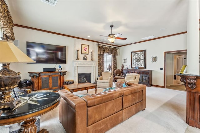 4608 Greystone Ct, Norman, OK 73072 - living room featuring light carpet, visible vents, a glass covered fireplace, a ceiling fan, and ornamental molding