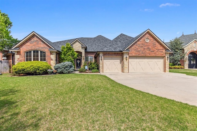 4608 Greystone Ct, Norman, OK 73072 - ranch-style house with concrete driveway, an attached garage, brick siding, and a front yard