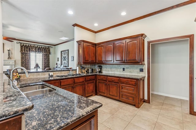 4608 Greystone Ct, Norman, OK 73072 - kitchen with dark stone countertops, a sink, backsplash, and crown molding