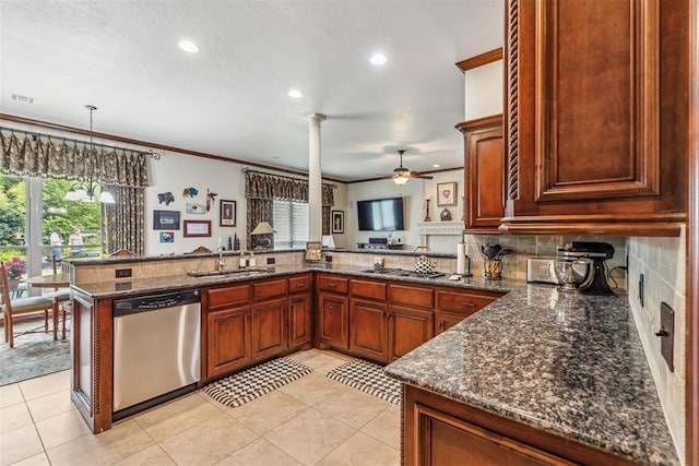 4608 Greystone Ct, Norman, OK 73072 - kitchen with a wealth of natural light, stainless steel dishwasher, a sink, and decorative columns
