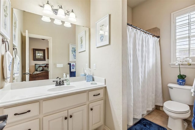 4608 Greystone Ct, Norman, OK 73072 - full bath with a shower with curtain, vanity, tile patterned flooring, and toilet
