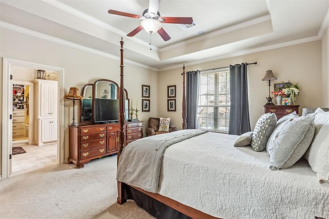 4608 Greystone Ct, Norman, OK 73072 - bedroom featuring connected bathroom, light carpet, a tray ceiling, ornamental molding, and visible vents