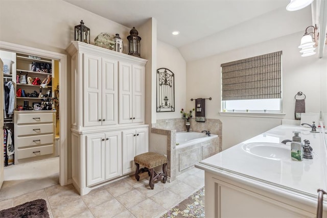 4608 Greystone Ct, Norman, OK 73072 - full bathroom with a garden tub, tile patterned floors, a sink, a walk in closet, and double vanity