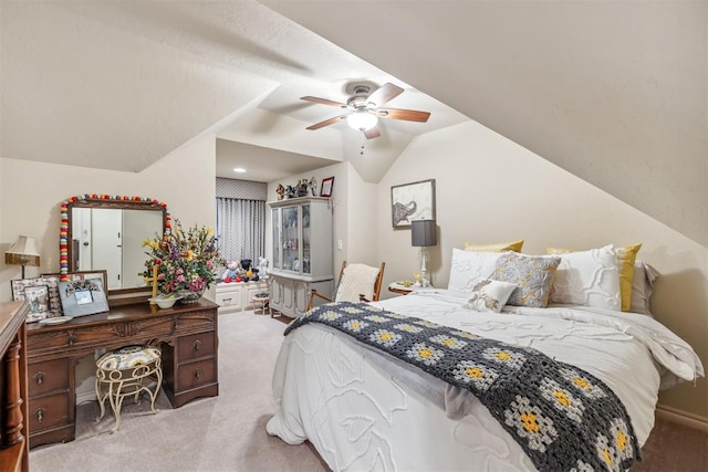 4608 Greystone Ct, Norman, OK 73072 - bedroom with vaulted ceiling, a ceiling fan, and light carpet