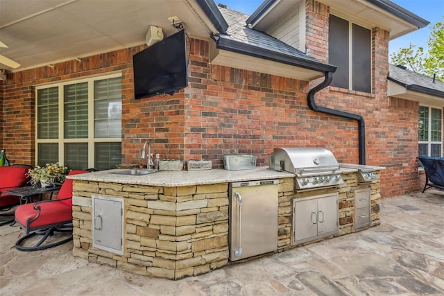4608 Greystone Ct, Norman, OK 73072 - view of patio / terrace with exterior kitchen, area for grilling, and a sink