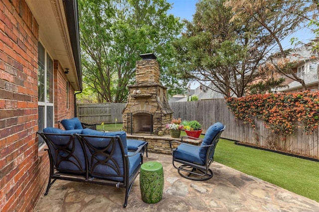 4608 Greystone Ct, Norman, OK 73072 - view of patio with an outdoor stone fireplace and a fenced backyard