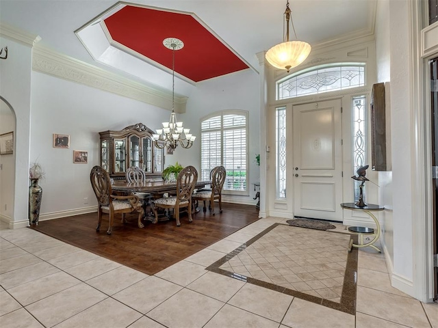 8016 NW 124th St, Oklahoma City, OK 73142 - entrance foyer with crown molding, a towering ceiling, light tile patterned floors, baseboards, and a chandelier
