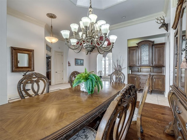 8016 NW 124th St, Oklahoma City, OK 73142 - dining space featuring crown molding, a chandelier, and light tile patterned flooring