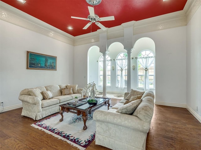 8016 NW 124th St, Oklahoma City, OK 73142 - living room with arched walkways, ornamental molding, ceiling fan, baseboards, and wood finished floors