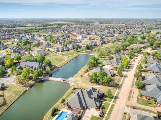 8016 NW 124th St, Oklahoma City, OK 73142 - aerial view of property and surrounding area featuring a nearby body of water and nearby suburban area