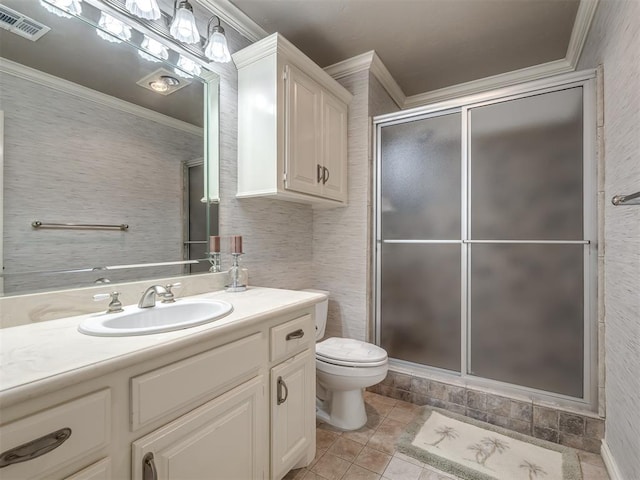 8016 NW 124th St, Oklahoma City, OK 73142 - bathroom featuring crown molding, a shower stall, toilet, vanity, and tile patterned floors