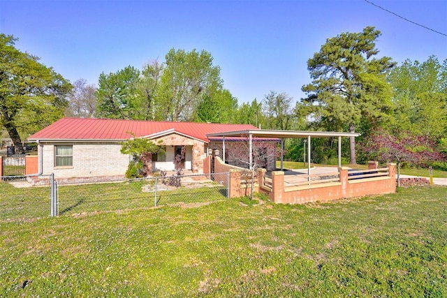 6205 S Choctaw Rd, Choctaw, OK 73020 - view of front of home featuring a front lawn, fence, and metal roof