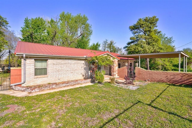 6205 S Choctaw Rd, Choctaw, OK 73020 - ranch-style home with a gate, a front lawn, fence, metal roof, and brick siding
