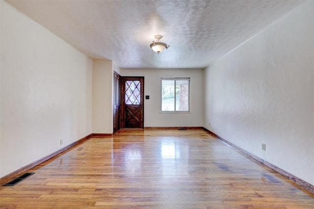 6205 S Choctaw Rd, Choctaw, OK 73020 - entrance foyer featuring baseboards, wood finished floors, and visible vents