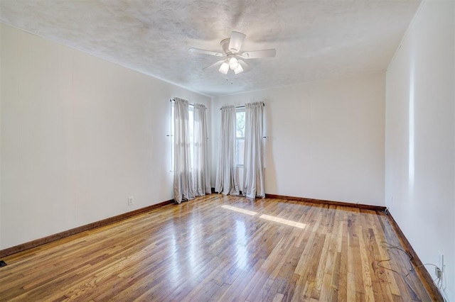 6205 S Choctaw Rd, Choctaw, OK 73020 - spare room featuring baseboards, hardwood / wood-style flooring, and ceiling fan