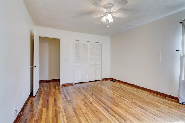 6205 S Choctaw Rd, Choctaw, OK 73020 - unfurnished bedroom featuring a ceiling fan, baseboards, light wood-style floors, and a closet
