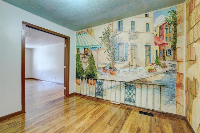 6205 S Choctaw Rd, Choctaw, OK 73020 - interior space featuring baseboards, wood finished floors, and visible vents