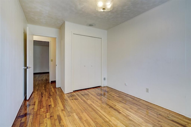 6205 S Choctaw Rd, Choctaw, OK 73020 - unfurnished bedroom with light wood finished floors and a closet