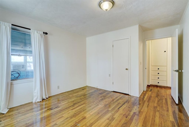6205 S Choctaw Rd, Choctaw, OK 73020 - unfurnished bedroom with light wood-type flooring