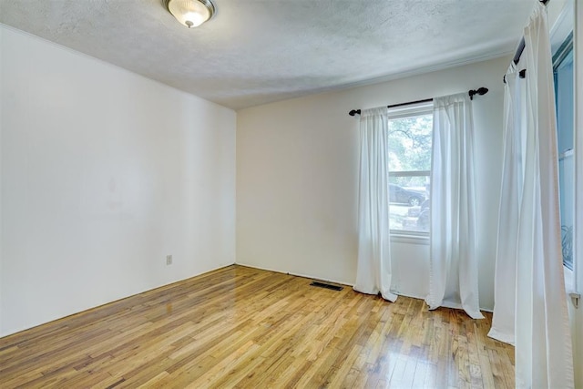 6205 S Choctaw Rd, Choctaw, OK 73020 - spare room with visible vents and light wood-style flooring