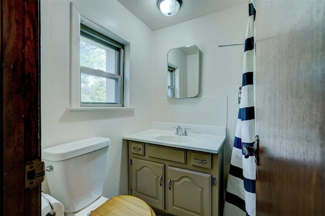 6205 S Choctaw Rd, Choctaw, OK 73020 - bathroom featuring backsplash, toilet, and vanity