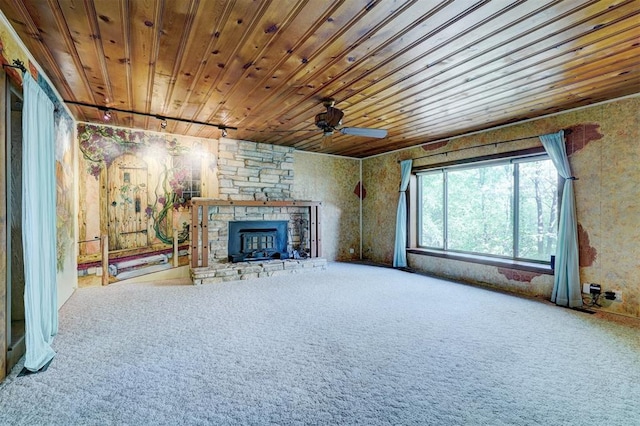 6205 S Choctaw Rd, Choctaw, OK 73020 - unfurnished living room featuring a fireplace, carpet floors, a ceiling fan, and wooden ceiling