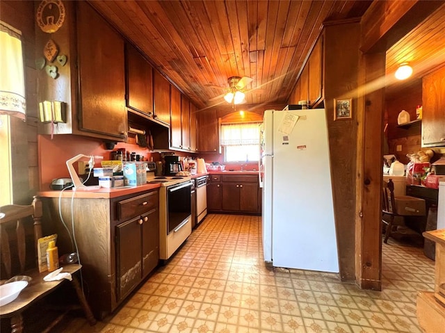 kitchen with light floors, wooden ceiling, and white appliances