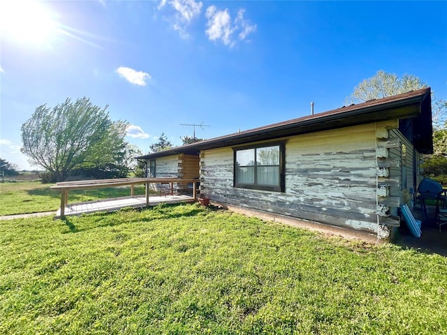 view of home's exterior featuring a yard
