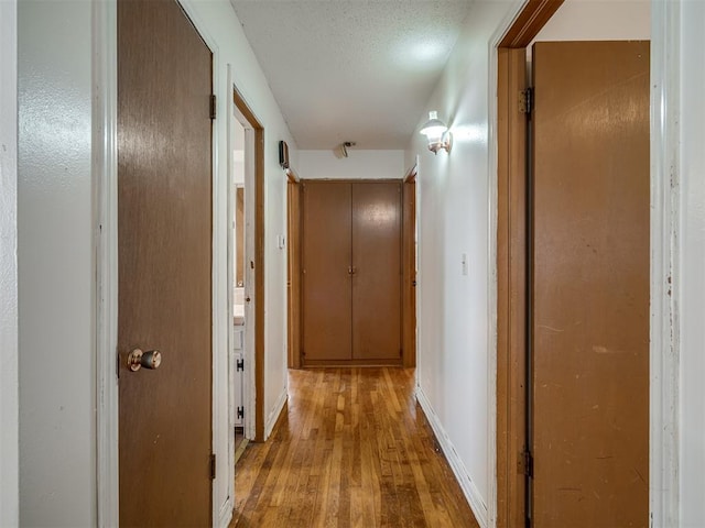 320 Willow Pl, Yukon, OK 73099 - hall featuring wood-type flooring and baseboards