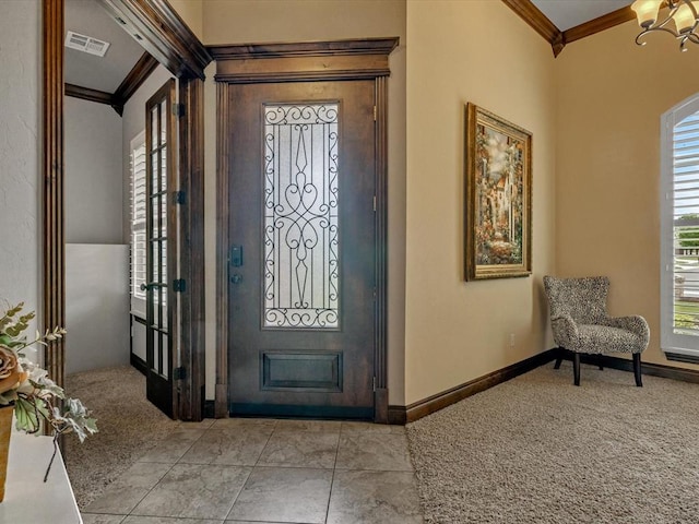 13401 Grapevine Trl, Oklahoma City, OK 73170 - carpeted foyer featuring ornamental molding, a chandelier, and baseboards
