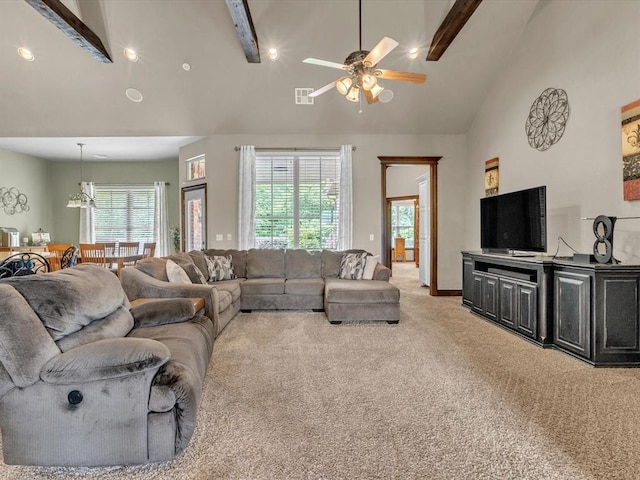 13401 Grapevine Trl, Oklahoma City, OK 73170 - living area featuring light carpet, a ceiling fan, beamed ceiling, plenty of natural light, and high vaulted ceiling