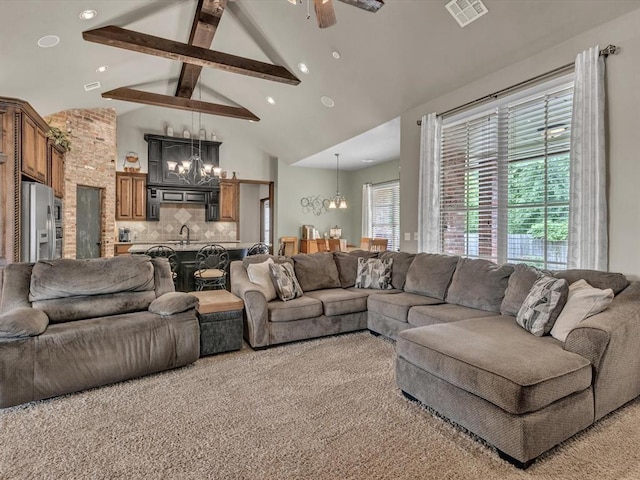 13401 Grapevine Trl, Oklahoma City, OK 73170 - living area featuring a chandelier, beamed ceiling, ceiling fan, high vaulted ceiling, and light carpet