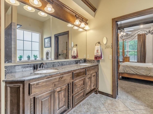13401 Grapevine Trl, Oklahoma City, OK 73170 - full bathroom featuring double vanity, a ceiling fan, tile patterned floors, baseboards, and ensuite bathroom
