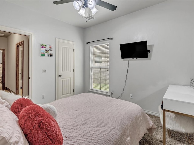 13401 Grapevine Trl, Oklahoma City, OK 73170 - carpeted bedroom with baseboards and a ceiling fan