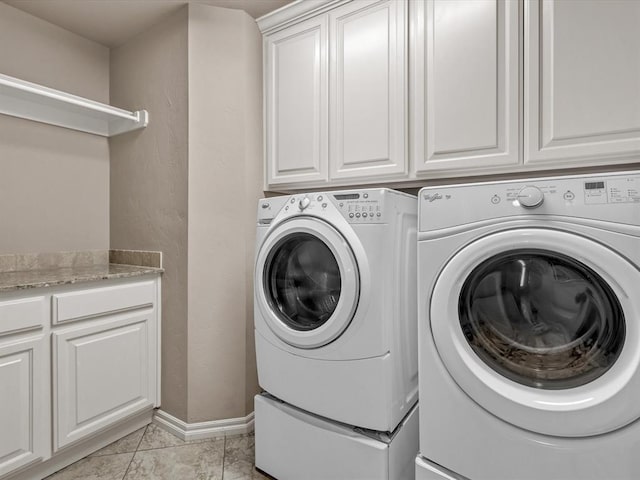 13401 Grapevine Trl, Oklahoma City, OK 73170 - laundry room featuring washing machine and dryer, cabinet space, and baseboards