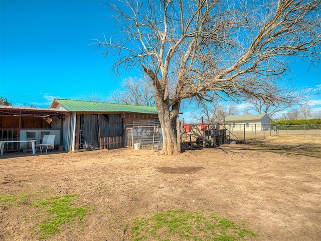 view of yard featuring an exterior structure and an outdoor structure