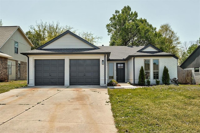 1804 Foxfire Rd, Edmond, OK 73003 - single story home featuring a front lawn, driveway, fence, a garage, and brick siding