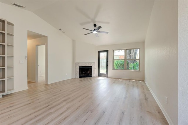 1804 Foxfire Rd, Edmond, OK 73003 - unfurnished living room featuring vaulted ceiling, a ceiling fan, light wood-style floors, and visible vents