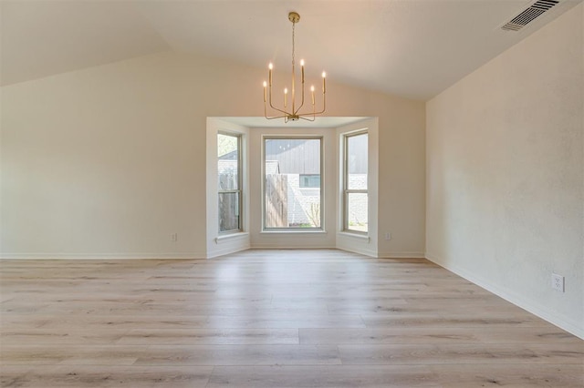 1804 Foxfire Rd, Edmond, OK 73003 - unfurnished dining area featuring an inviting chandelier, vaulted ceiling, visible vents, light wood-style floors, and baseboards