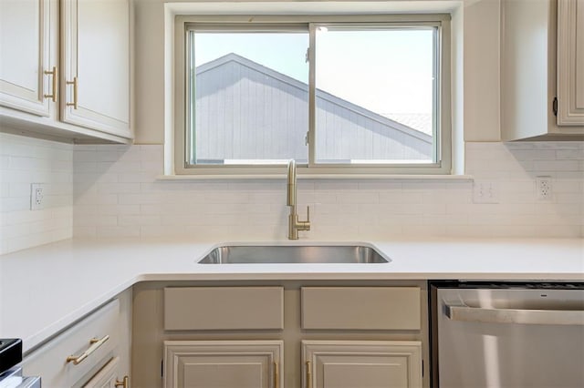 1804 Foxfire Rd, Edmond, OK 73003 - kitchen featuring decorative backsplash, dishwasher, light countertops, and a sink