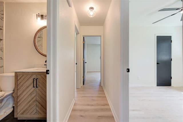 1804 Foxfire Rd, Edmond, OK 73003 - hallway with baseboards and light wood-style floors