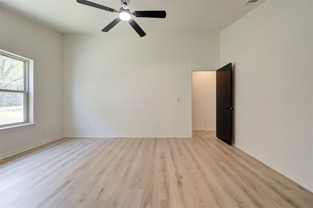 1804 Foxfire Rd, Edmond, OK 73003 - spare room featuring light wood-style flooring, baseboards, and a ceiling fan