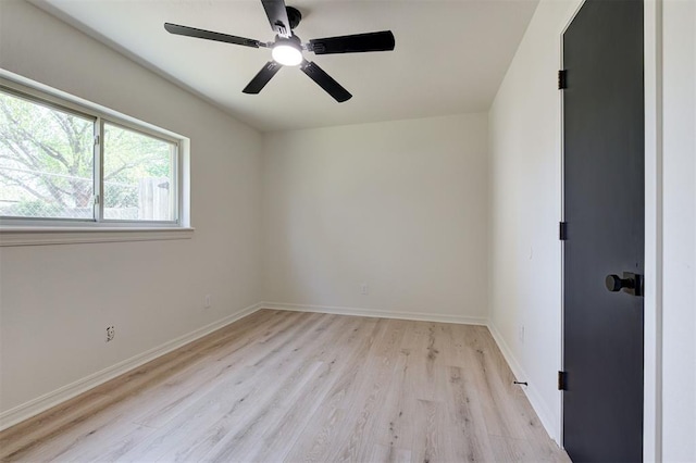 1804 Foxfire Rd, Edmond, OK 73003 - unfurnished room with baseboards, a ceiling fan, and light wood-style floors