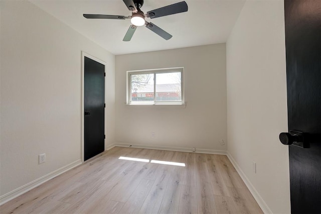 1804 Foxfire Rd, Edmond, OK 73003 - spare room featuring wood finished floors, a ceiling fan, and baseboards