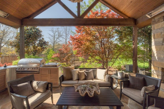 exterior space with an outdoor hangout area, fence, a gazebo, and area for grilling
