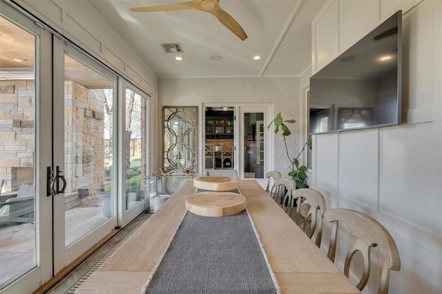 sunroom featuring visible vents and wood finished floors