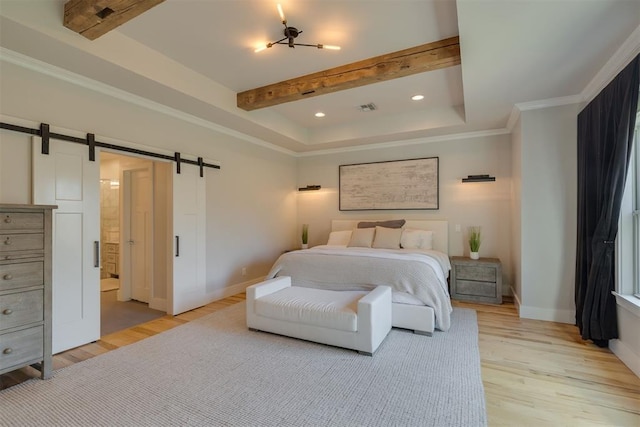 bedroom with a barn door, recessed lighting, baseboards, light wood-type flooring, and visible vents