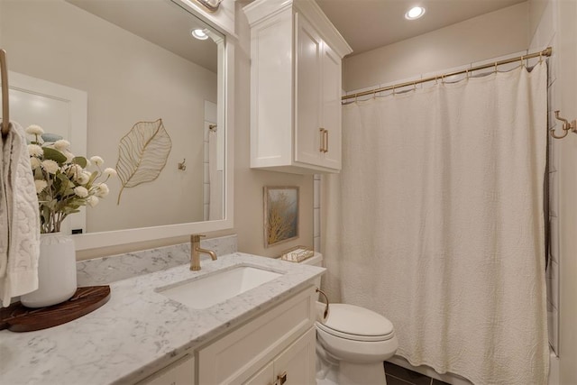 full bath with recessed lighting, vanity, and toilet